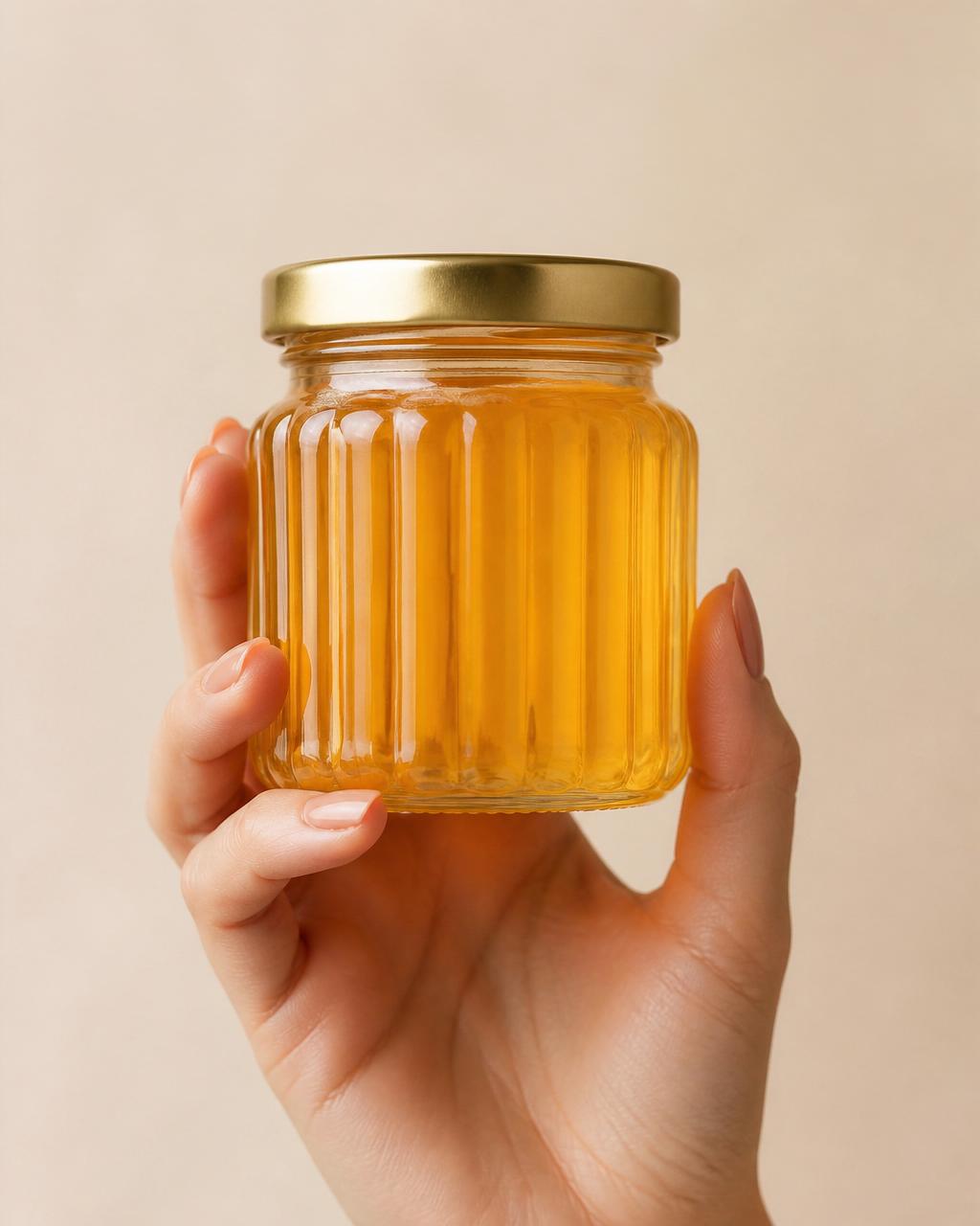 Hands holding Afrina honey